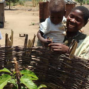 A man and child in front of a basket.