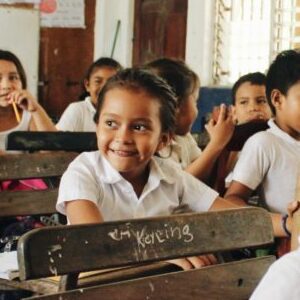 A group of students sitting in a classroom.