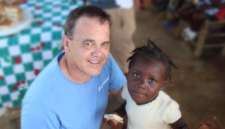 A man and child pose for the camera.