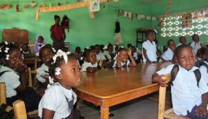 A group of children sitting at a table.