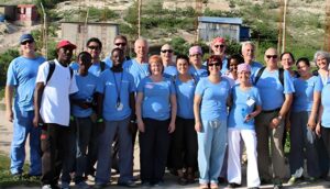 A group of people standing together wearing blue tshirts